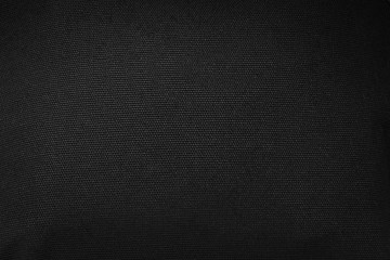 Black fabric texture background. Detail of dark textile.