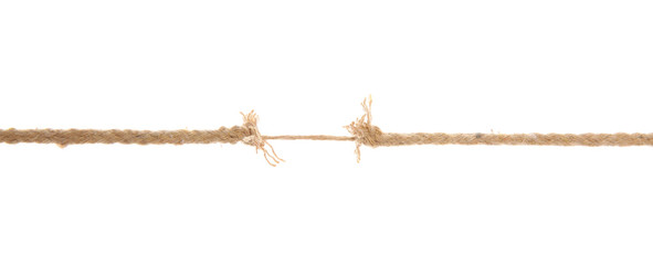 Frayed rope at breaking point on white background