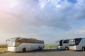 Three buses staying in the parking lot Front Way