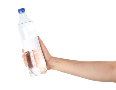 Man holding plastic bottle of pure water with blank tag on white background