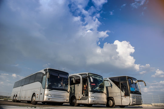 Three Buses Staying In The Parking Lot Front Way