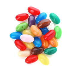 Pile of delicious colorful dragee candies on white background