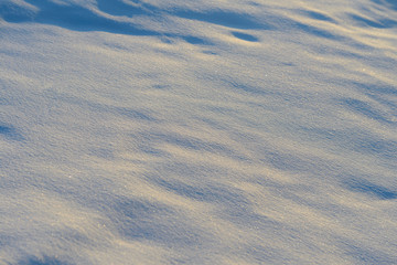 Fototapeta premium surface of snowdrifts in winter sunny day