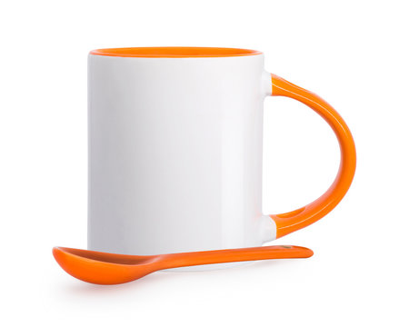 Ceramic mug and spoon isolated on white background. Template of blank drink cup for your design. Clipping paths object.