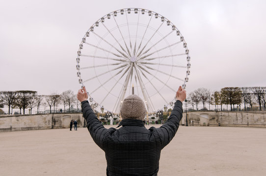 Person Posing With Observation Wheel