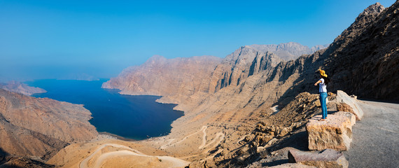 Woman enjoying view over Fjord Khor Najd in Oman