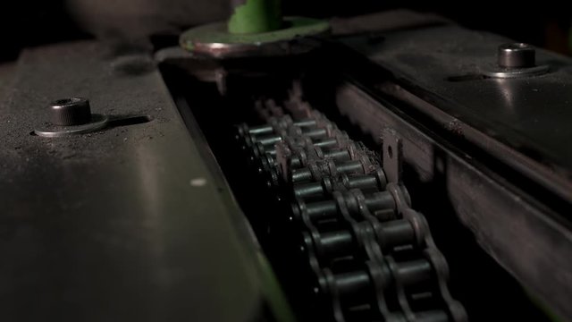 Iron Conveyor Chain Moves In The Old Iron Machine