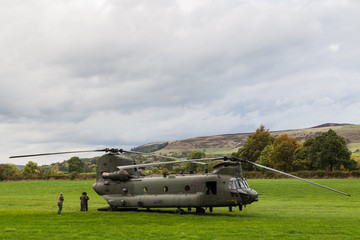 The crew outside a Royal Air Force CH-47-HC.6A Chinook helicopter after its temporarily grounded following a bird strike during low level flying in the Peak District on 11 October 2018.