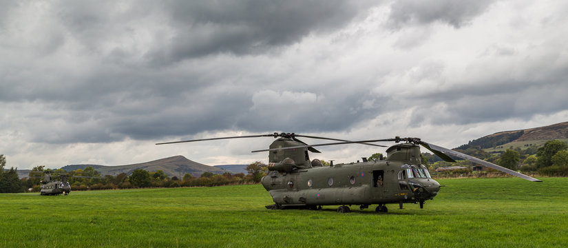 Two Royal Air Force CH-47-HC.6A Chinook helicopters in a field after the front one hit a bird during low level flying...Seen from the roadside near Bamford in the Peak District on 11 October 2018.