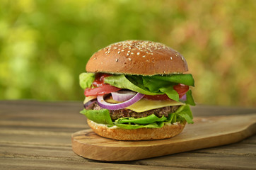 Autumn burger on wooden table