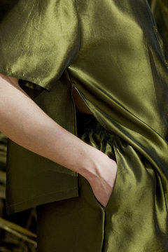 Hand In Pocket Of Green Trousers