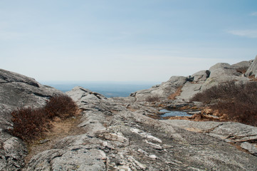 Rolling mountain landscape viewed from the side of a rocky mountain