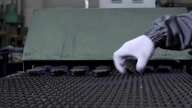 Worker At The Factory Take Small Black Iron Parts