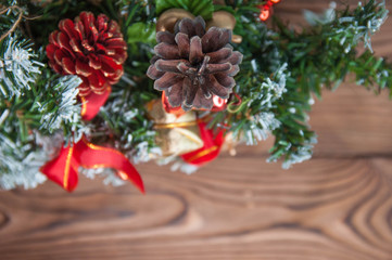 Fototapeta na wymiar Happy new year and Merry Christmas concept. Christmas tree with new year decoration and bokeh on the wooden background.