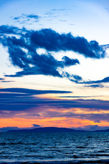 Sunset in Follonica in late winter with cloudscape and shades of red