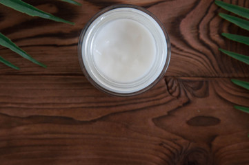 Natural and organic cosmetic concept. White cream in jar