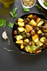 Fried potatoes with mushroom and sausage