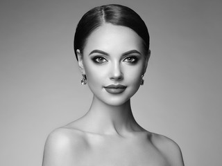 Beautiful Young Woman with Clean Fresh Skin. Perfect Makeup. Beauty Fashion. Eyelashes. Cosmetic Eyeshadow. Highlighting. Cosmetology, Beauty and Spa