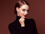 Beautiful Young Woman with Clean Fresh Skin. Perfect Makeup. Beauty Fashion. Red Lips. Cosmetic Eyeshadow. Smooth Hair. Girl in Black Turtleneck