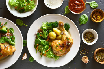 Grilled chicken leg with potato and green salad