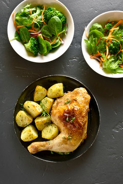 Chicken leg with potato and green salad
