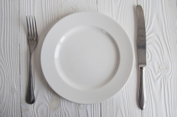 White empty plate from wooden letters: Diet, anorexia and hunger concept. 