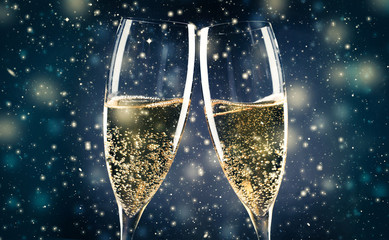 two champagne glasses ready to bring in the New Year - obrazy, fototapety, plakaty