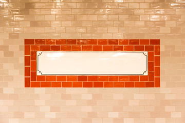 White panel with copyspace on a tiled wall