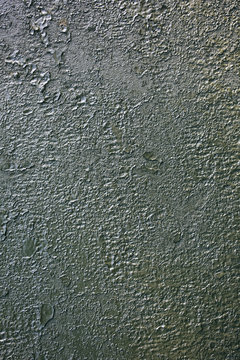Old green peeling paint on the armored fighting vehicle. Rusty dye background texture.