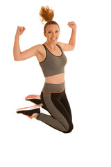 Beautiful young woman jumps gesturing success isolated over white background