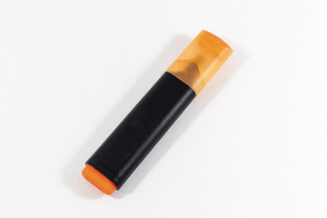 Close-up shoot of orange colored highlighter pen with white background