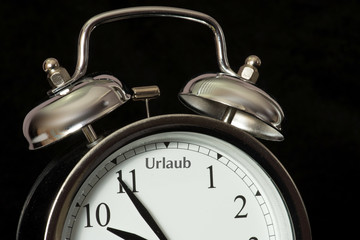 Ein Wecker und Urlaub