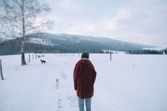 Girl on a hike in snow covered nature