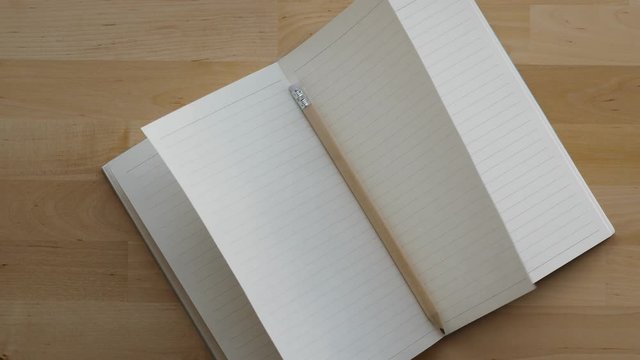 Clean notebook pages swing in the wind