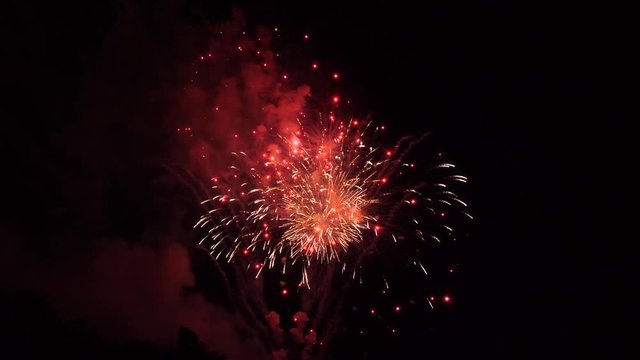 red and white fireworks with glitter and balls