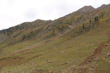 Closeup view of big mountains under clouds