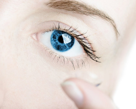  inserting a contact lens in female eye