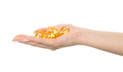 Hand is giving Omega 3 capsules
