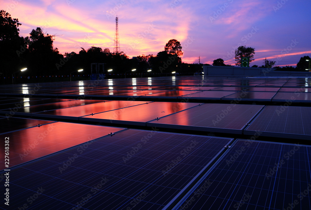 Wall mural Solar PV Rooftop at Dawn Red Cloud Sky