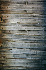 Old vintage wooden planks of the house. Grey wood texture background.