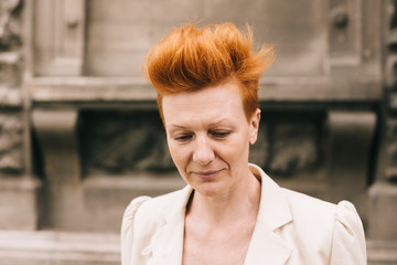 attractive woman of fifty years with red hair