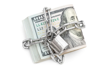 Folded dollar bills bound by metal chain with padlock. Business concept.