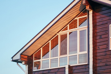 Part of facade of modern house with glazed veranda