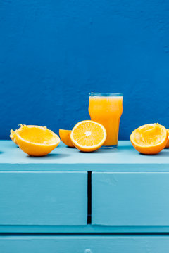 Orange juice on blue background