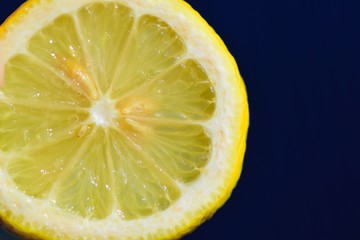 Macro details of yellow Lemon slices in black background