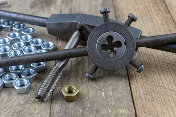 Dies and tap for thread cutting in locksmith works. Accessories for a mechanic.