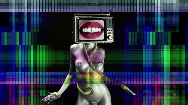 amazing woman painted silver like a robot dancing and posing with a television as a head. the tv has pouting women's red lips on it