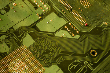 Computer motherboard. Tracks on the printed circuit board. Electronic components. Resistor,...
