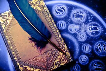 horoscope with zodiac signs and magic book and feather like astrology magic mystical concept 