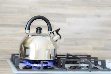 kettle on a gas stove flame burn not boiling